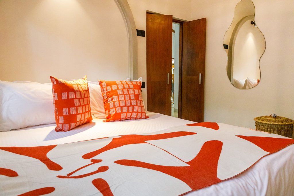 Safiya master bed with accent pillows